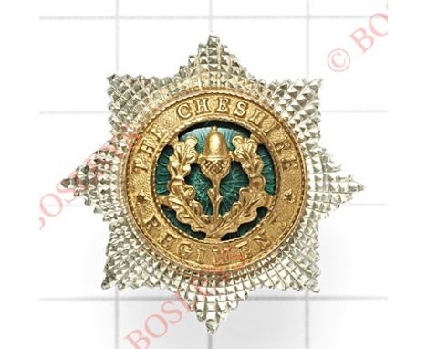 Cheshire Regiment Officer’s silver, gilt and green enamel forage cap star.A fine example. Reverse impressed ‘S’ for Sterling 
