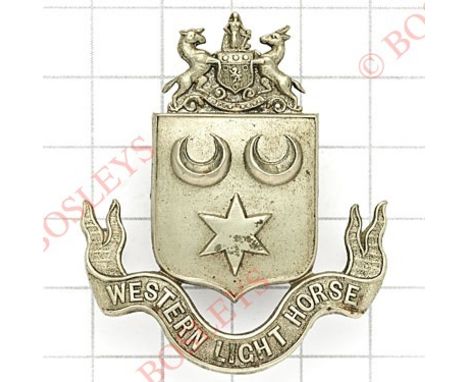 South African Western Light Horse cap badge circa 1904-08.Short lived die-stamped white metal example. (Owen 335)