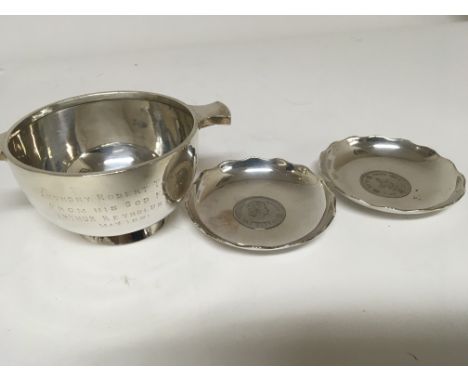 A silver presentation cup inscribed Birmingham hallmarks and two silver coin dishes inset with Hong Kong dollar. Weight 173g