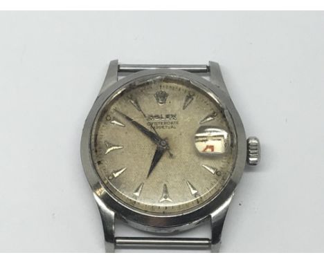 A Vintage Rolex Oyster Perpetual Gents watch circa 1954 the dial with raised batons red numbered date aperture. Serial number