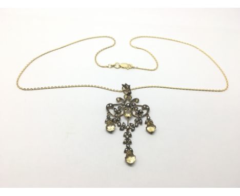 A yellow metal pendant set with citrine, pearl and small diamonds.