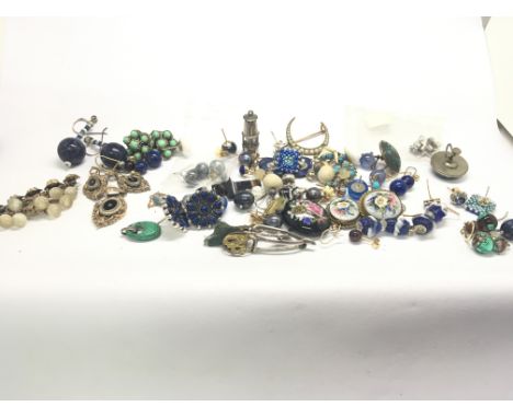 A good collection of earrings brooches and pendants including gold turquoise enamel and others.