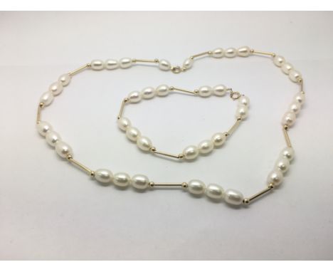 A cultured pearl necklace and matching bracelet with 9ct gold fittings and interconnecting bars.