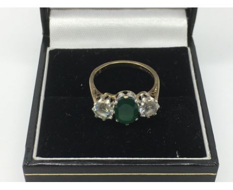 A 9ct gold three stone ring, approx size K and approx 2.4g.