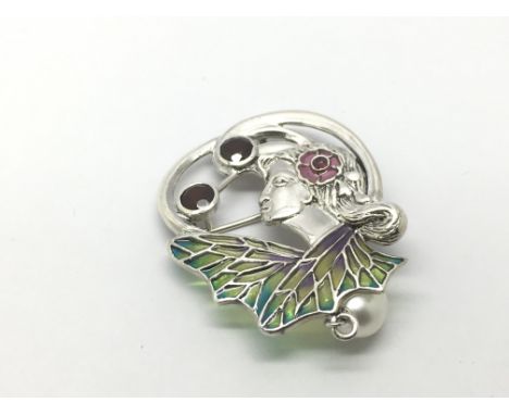 A large silver plique a jour 'flora' brooch/ pendant set with a suspended pearl, garnets and ruby.