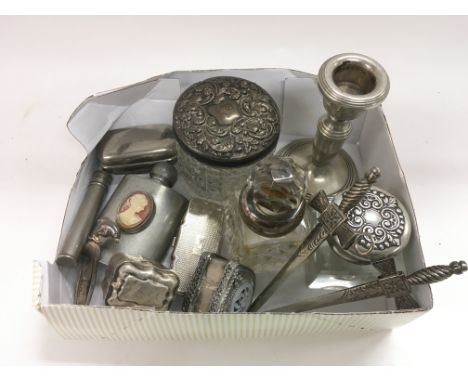 A collection of small silver and white metal items including a silver candlestick, bookmarks etc.