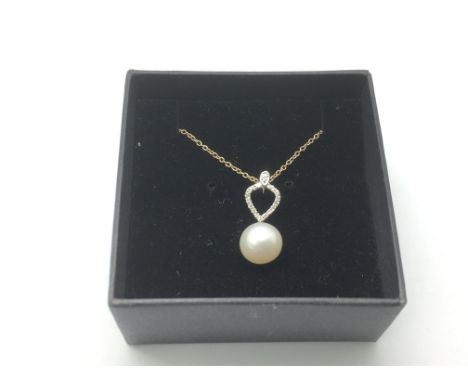 A 14ct gold necklace with cultured pearl and diamonds set in an inverted pearl shaped bale, approx 2.3g.