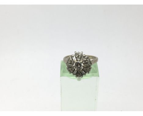 An 18ct gold diamond cluster ring, approx size K-L and approx 5g.