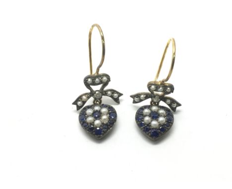 A pair of yellow metal heart shaped earrings set with sapphire, pearl and small diamonds.