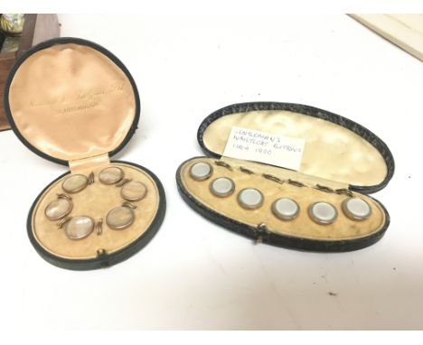 Two cased sets of mother of Pearl and gold rimmed Gentleman Waistcoat studs (2)