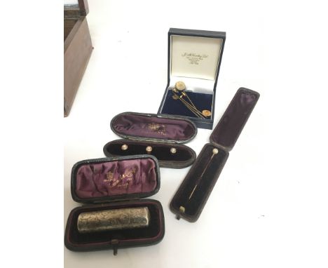 A cased set of mother of pearl dress studs a conforming stick pin and others some gold and a silver scent bottle in a fitted 