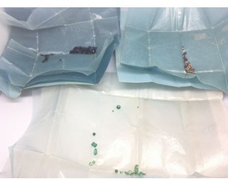A collection of loose gem stones approximately 2.4carat of emeralds 13.9 carat of Sapphire and 1.7carat of ruby all approxima