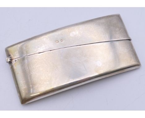 A George V silver rectangle curved card case, Birmingham 1923. 4 cm wide. 36.3 grammes total weight.