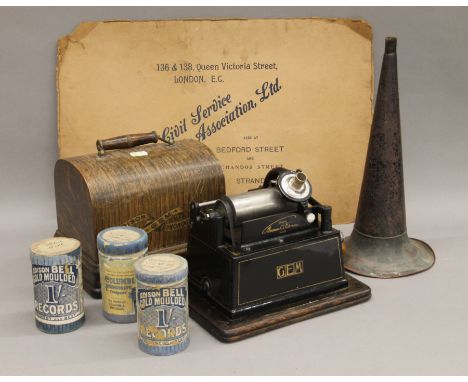 An Edison Gem phonograph and a collection of phonograph rolls. The former 28 cm long.