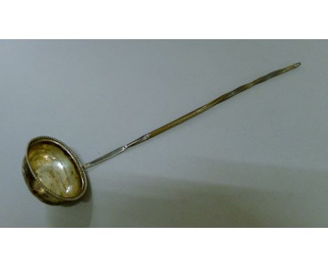 A Georgian silver baleen handled toddy ladle. 35 cm long.