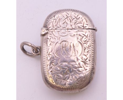 A Victorian silver vesta with leaf chased pattern, Birmingham 1898. 4 cm wide. 14.8 grammes.