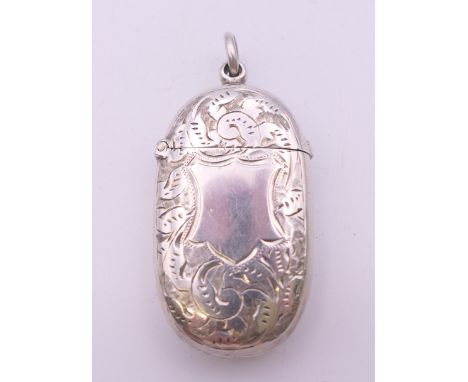 A Victorian silver vesta case with leaf/shield chased pattern, Birmingham 1898, maker's mark Hukin and Heath.  3 cm wide, 5 c