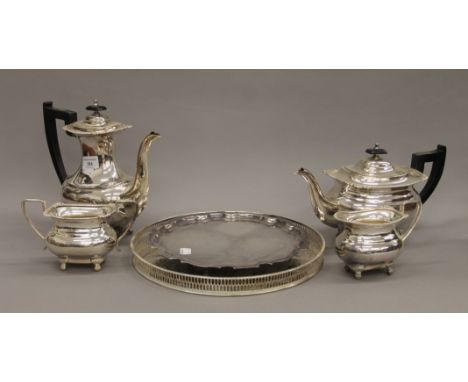 A silver plated tea set and two silver plated trays. The teapot 16 cm high. 