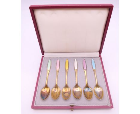 A cased set of six Danish silver and enamel coffee spoons. 
