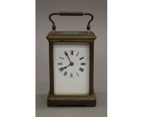 A brass carriage clock. 14 cm high.