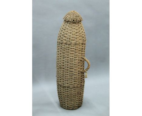 A vintage wicker eel trap. 107 cm long.