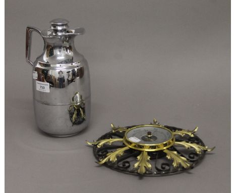 A vintage thermos jug and a wall barometer. The former 25 cm high.