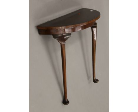 An early 20th century mahogany demi lune console table. 70 cm wide.