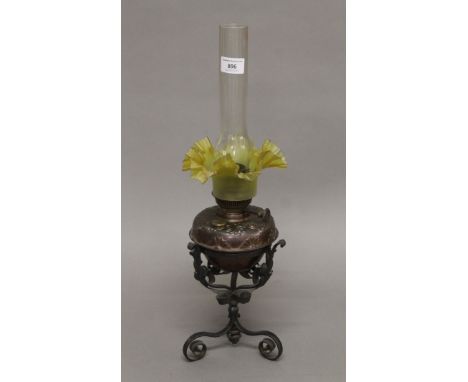 An Arts and Crafts oil lamp. 52 cm high overall.