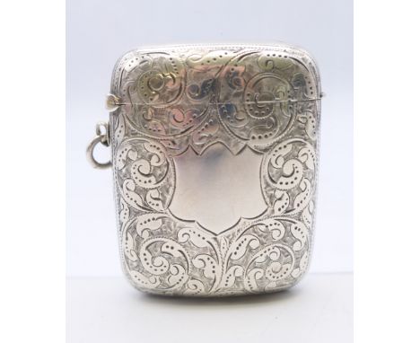A Victorian silver vesta with leaf chased pattern, Birmingham 1894. 4.5 cm wide, 5.5 cm high. 40 grammes.