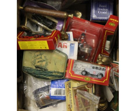  A box of toy cars, brass ware and a Chad Valley globe. 