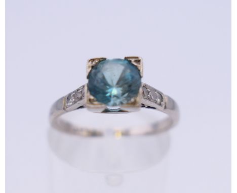 An 18 ct white gold and platinum diamond and topaz ring. Ring size M/N. 3.2 grammes total weight.