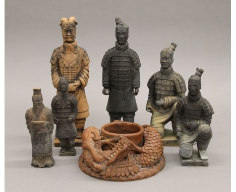 Six terracotta army model figures and a terracotta vase decorated with dragons. The largest 26 cm high. 