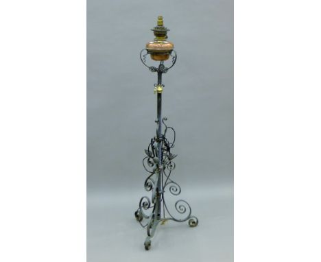 A Victorian Arts and Crafts standard lamp. 139 cm high.