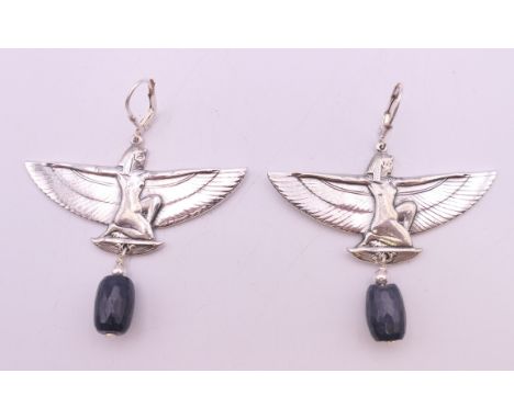 A pair of silver Deco style earrings.  5 cm wide.