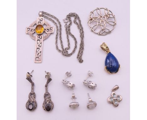 A collection of silver jewellery items.
