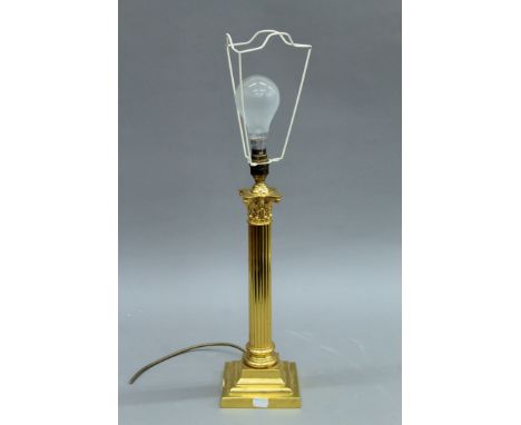An ormolu columnar table lamp. 43 cm high excluding bulb.