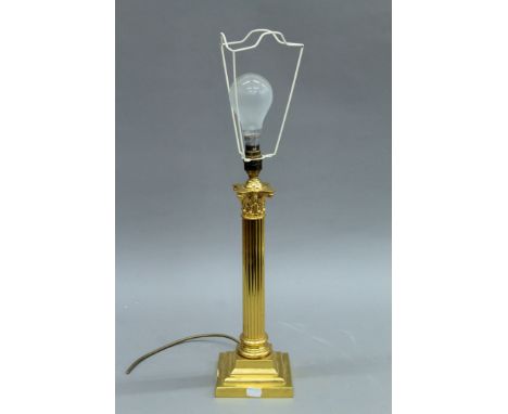 An ormolu columnar table lamp. 43 cm high excluding bulb.