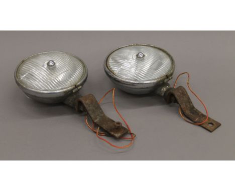 A pair of vintage Lucas car headlamps. 18 cm diameter.