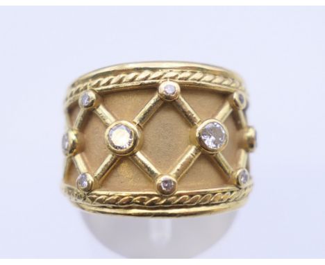 An Elizabeth Gage style 18 K gold diamond ring. Ring size M/N, 12.2 grams total weight.