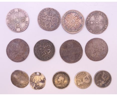 A small collection of early milled sixpences and early hammered silver coins.
