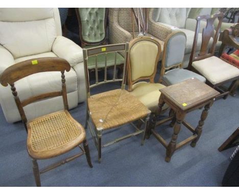 Mixed chairs to include a French beech carved bedroom chair, together with an oak stool and a bed head 