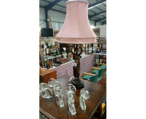 A figural table lamp with shade