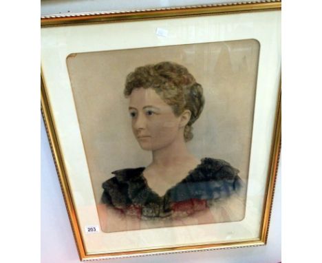 A framed and glazed portrait of a lady