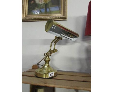 A brass desk lamp