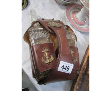 A ship's hanging decanter set