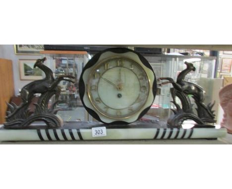 A French art deco mantel clock surmounted deer