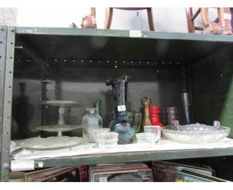 A shelf of glass ware including cake stands, vases etc