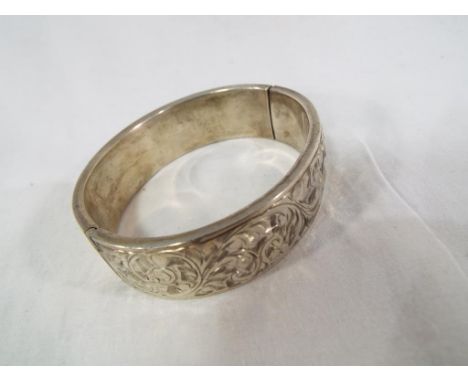 A silver hallmarked engraved bangle. Estimate £20 - £30