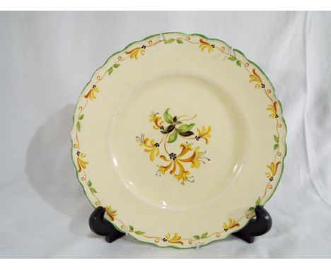 An A J Wilkinson ceramic plate bearing a Clarice Cliff signature, Est £10 - £20
