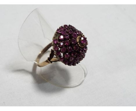 A lady's yellow gold ruby cluster ring, size N, approx. 5.3 gm - Est £75 - £100